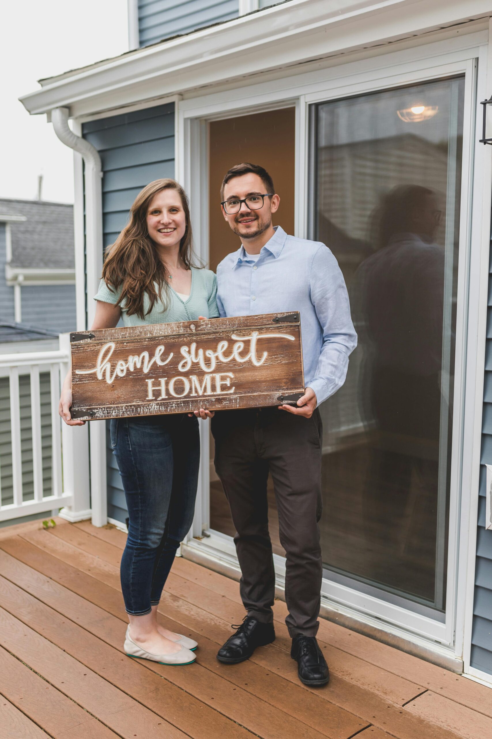 First-time home buyers reviewing keys at a new home